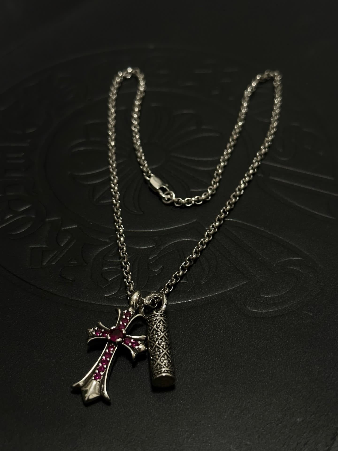 Chrome Hearts Silver Cross Pendant with Ruby Accents and cylindrical charm